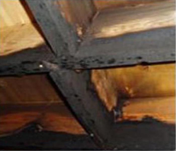 Soot covered, exposed floor joists
