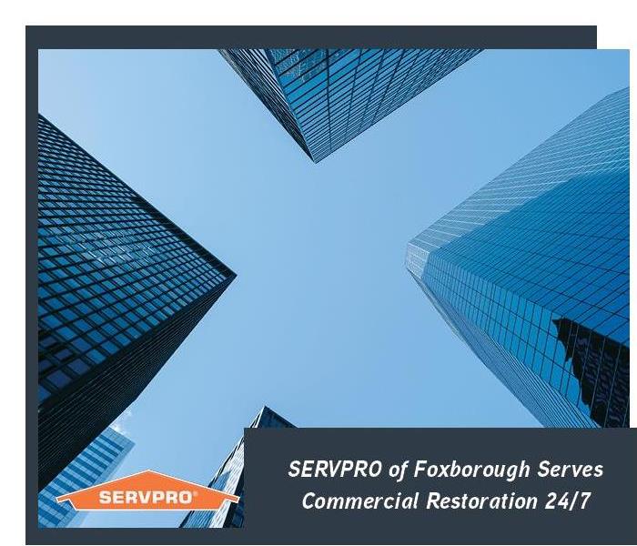 Building in background with dark text box and orange SERVPRO logo. 